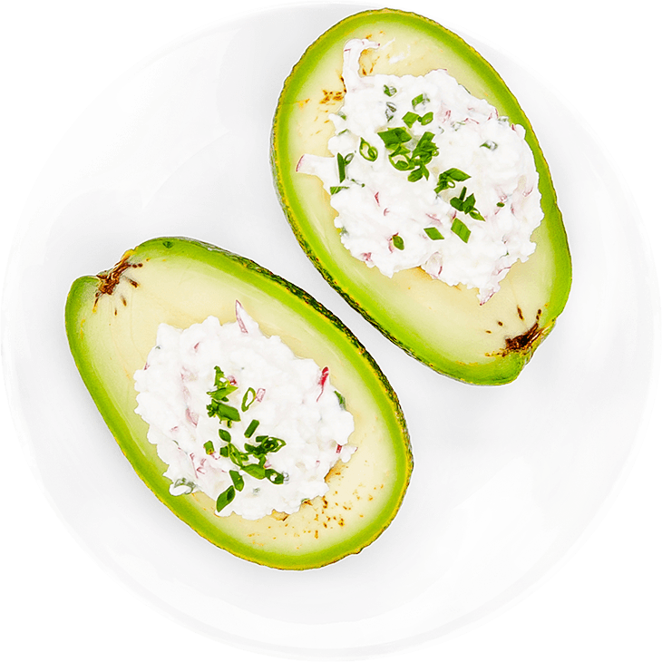 Stuffed avocado with cottage white cheese, radish and chives