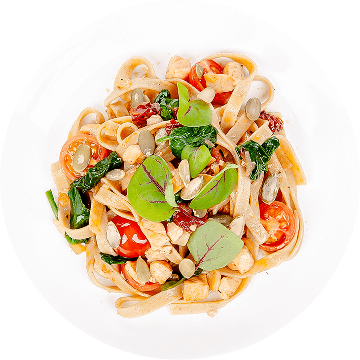 Pasta with salmon, cherry tomatoes and pumpkin seeds
