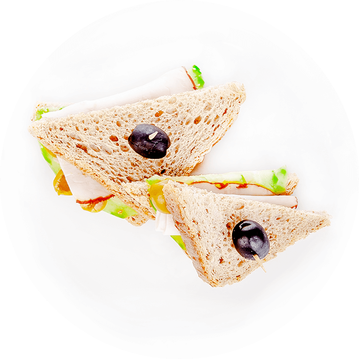 Sandwich with ham, cucumber and olives