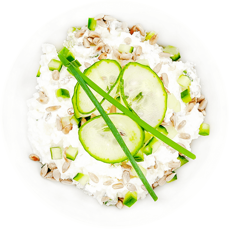 Cottage white cheese with cucumber and chives